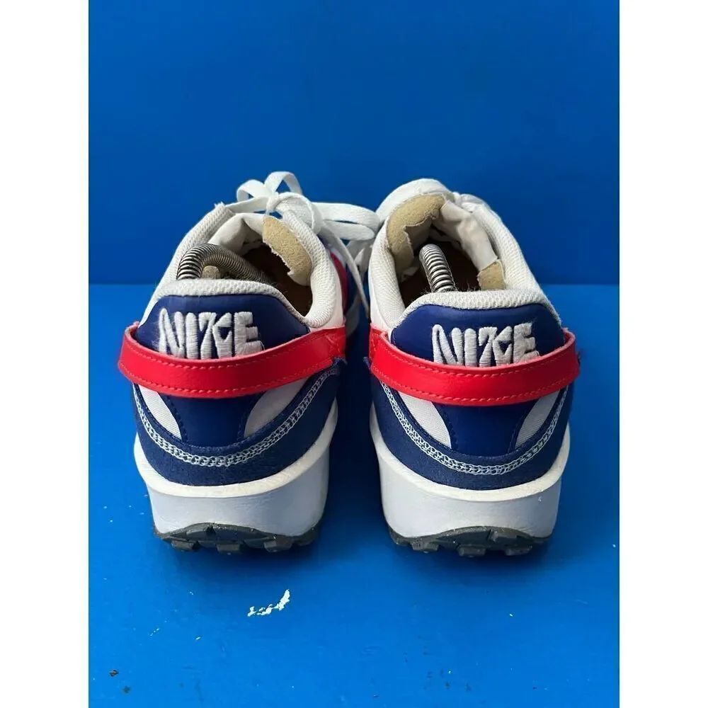 - Nike Waffle Debut Swoosh Old Royal Habanero Red is size 9.5
